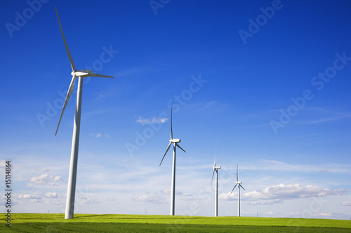 Windmills against blue sky