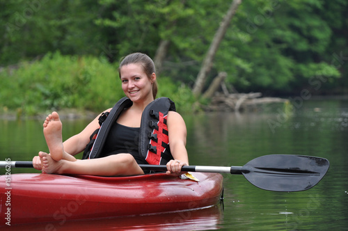 Woman relaxes on Kayak