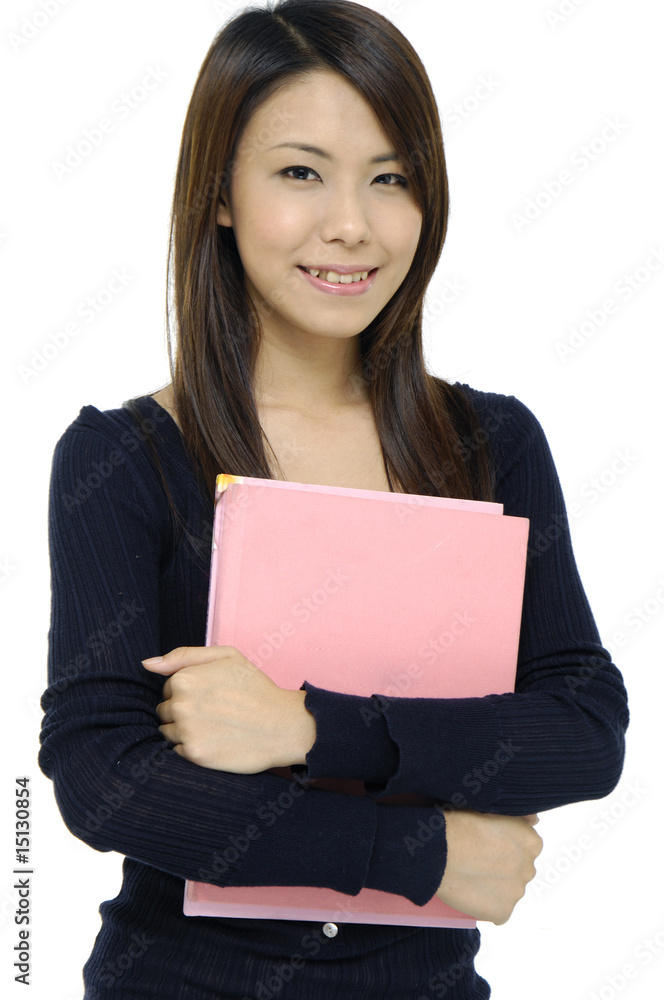 female smiling while carrying notebook female smiling while carrying notebook