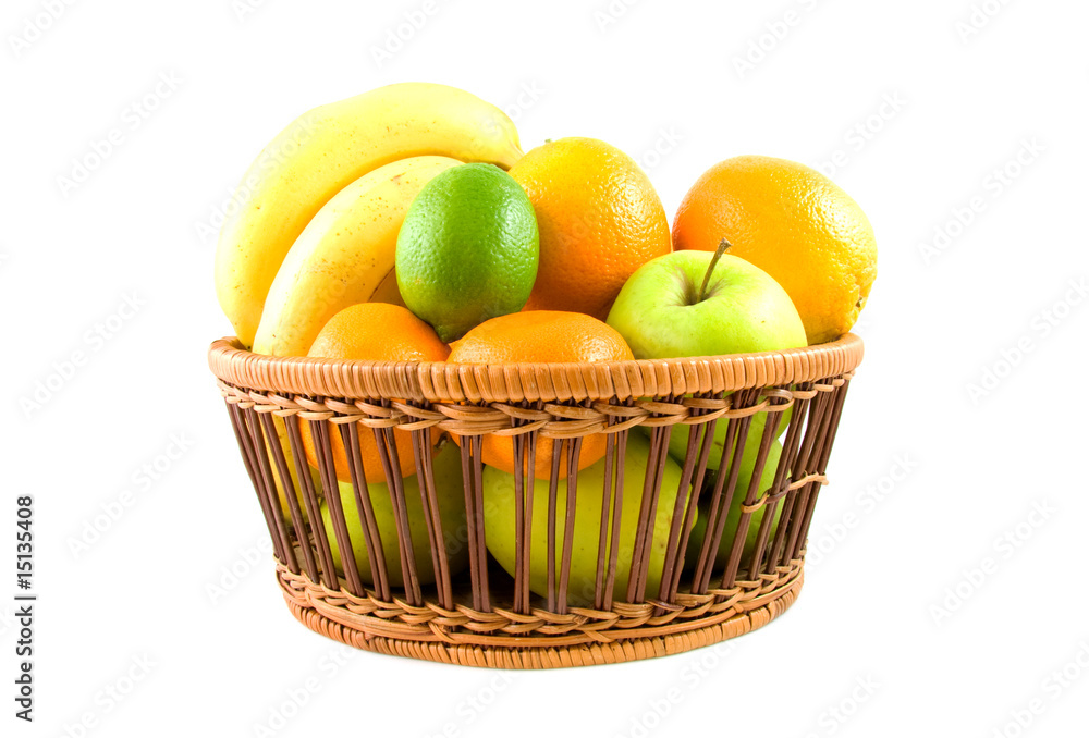 Basket filled with fresh fruits on white backgound