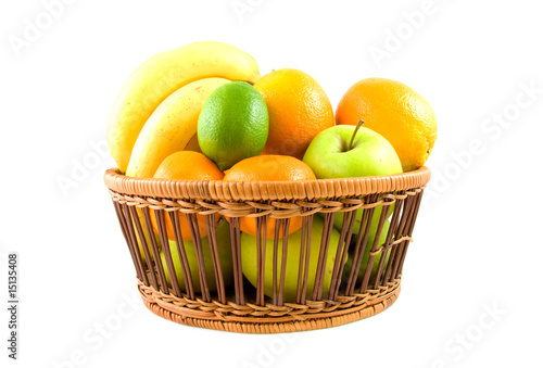 Fototapeta Naklejka Na Ścianę i Meble -  Basket filled with fresh fruits on white backgound