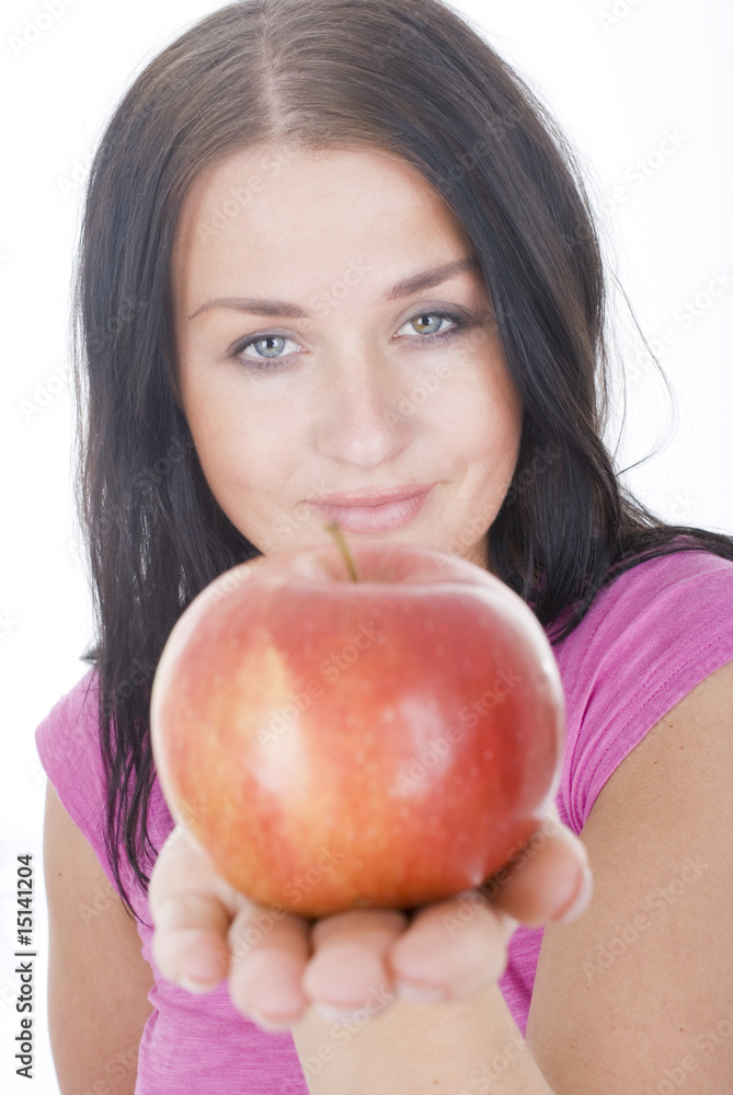 Pretty young smiling brunette woman with red apple Pretty young smiling brunette woman with red apple