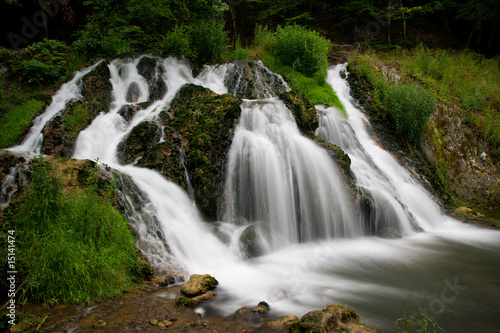 Fototapeta Naklejka Na Ścianę i Meble -  Waterfall in green forest shoot at long exposure