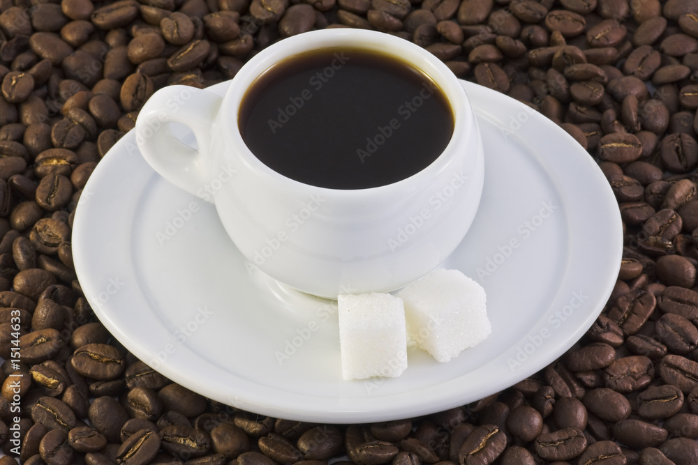 coffee beans and a cup of coffee coffee beans and a cup of coffee