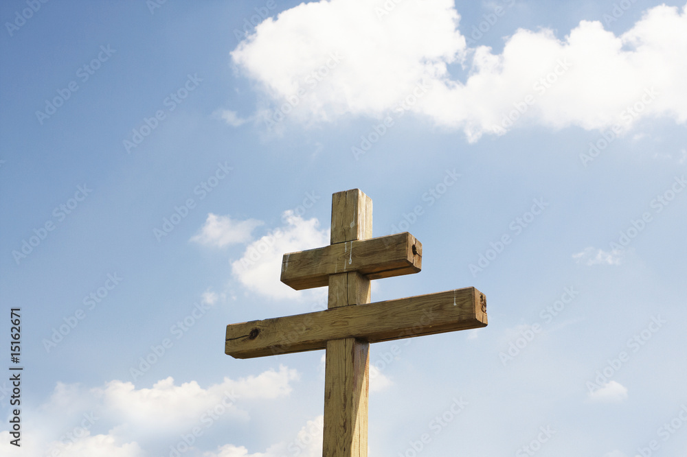 Wooden cross against a background of the sky
