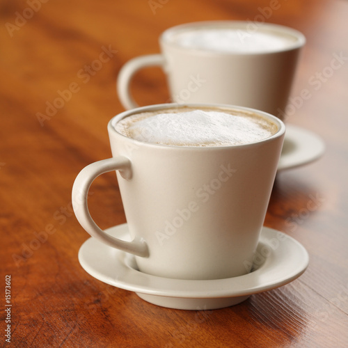Cups of coffee with milk