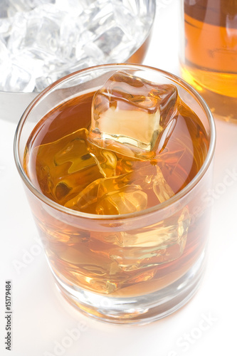 alcoholic beverage whith ice cubes © ampFotoStudio.com