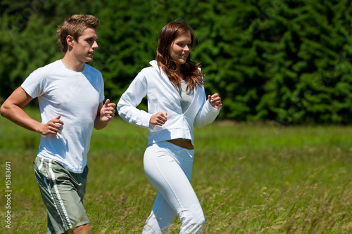 Young man and woman running