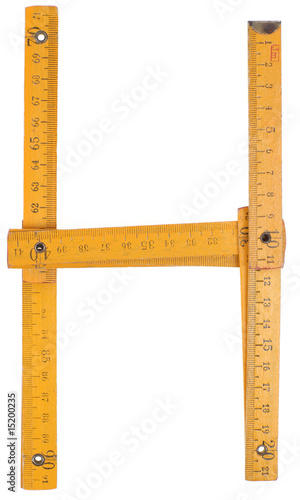 old yellow ruler forming font symbol H