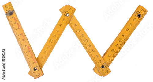 old yellow ruler forming font symbol  w