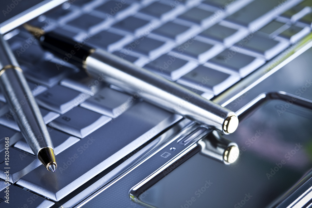Laptop pc over background and ballpoint Laptop pc over background and ballpoint