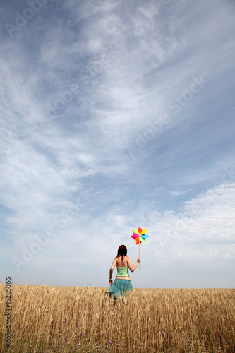 girl with toy wind turbine