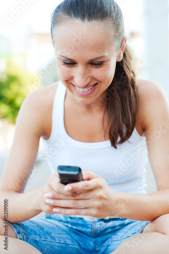 smiley woman writing text message