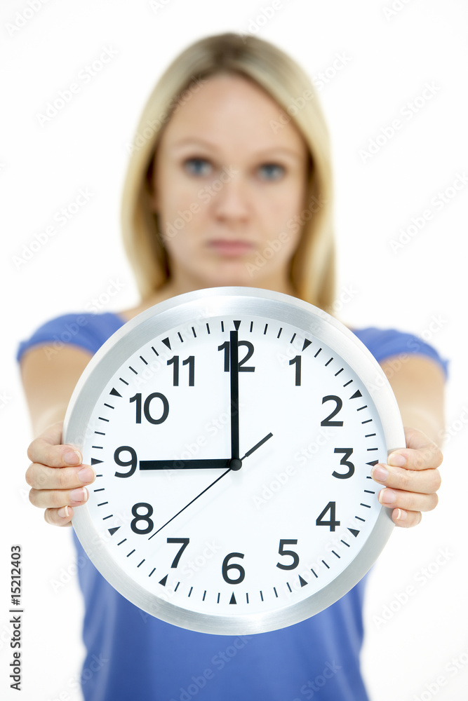 Woman Holding Clock Showing 9 O'Clock Woman Holding Clock Showing 9 O'Clock