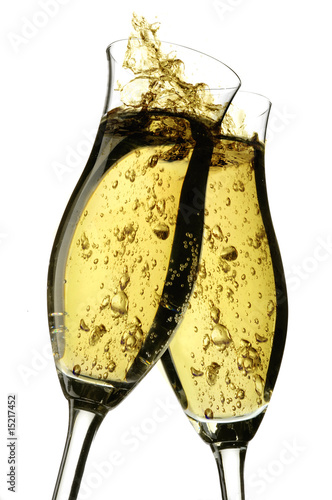 Photography Champagne cheers with bubbles on a white background