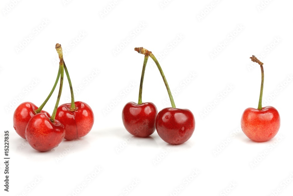 Red cherries isolated on the white background Red cherries isolated on the white background