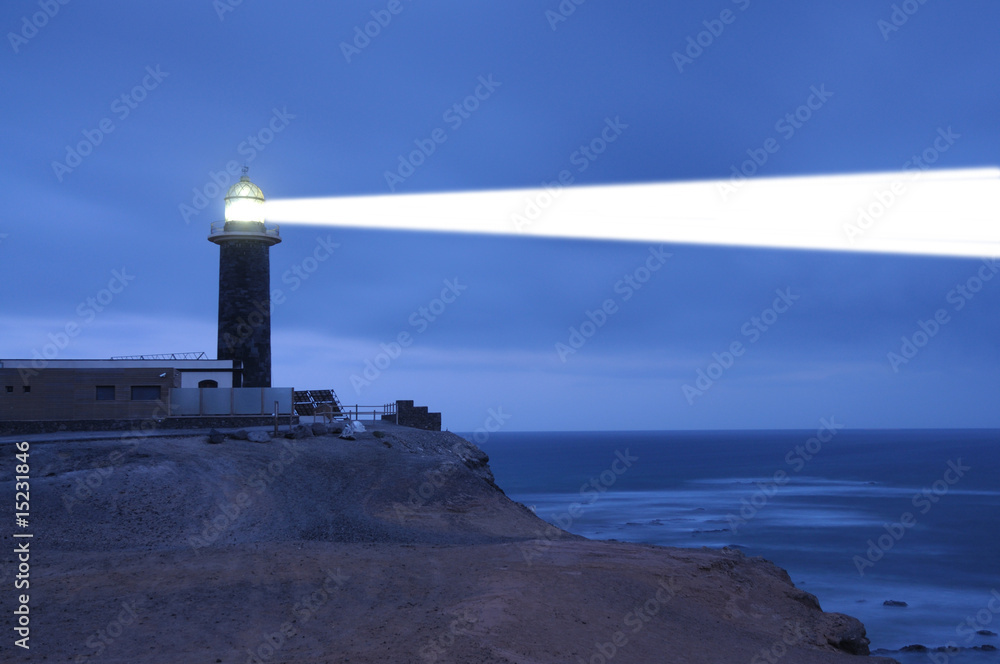 Lighthouse searchlight beam through foggy air