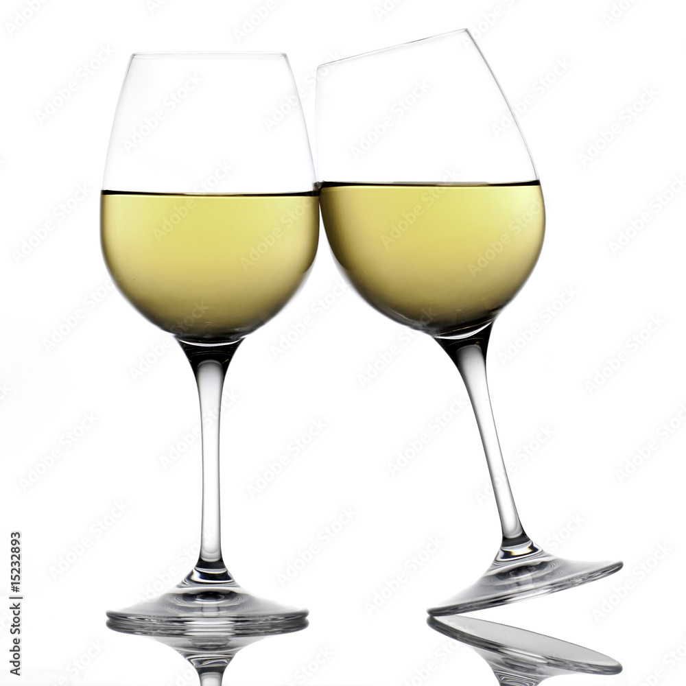 White wine glasses making a toast