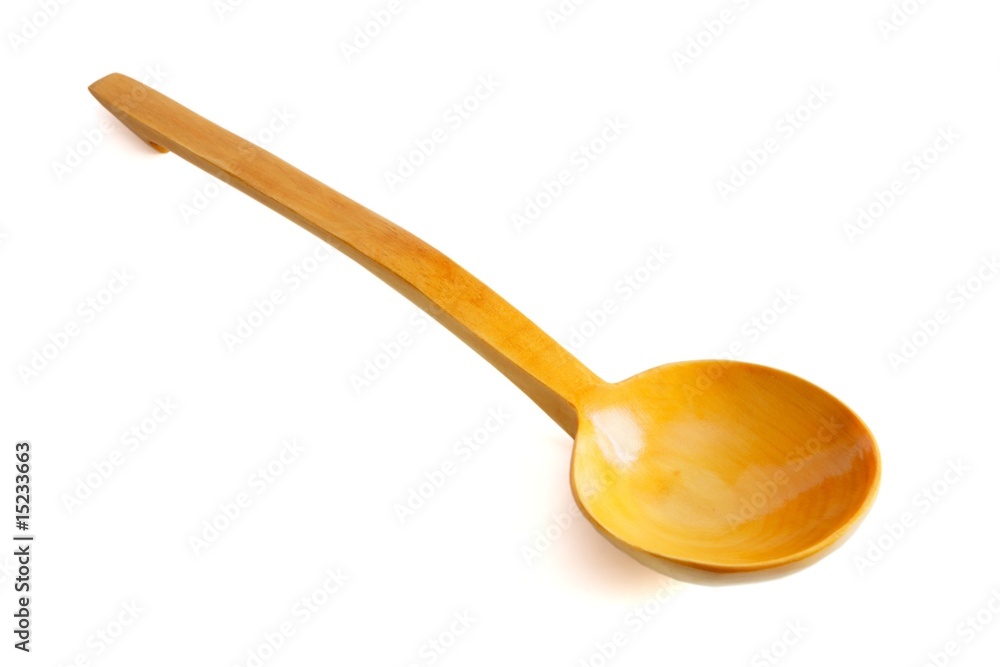 Yellow wooden spoon on white background Yellow wooden spoon on white background