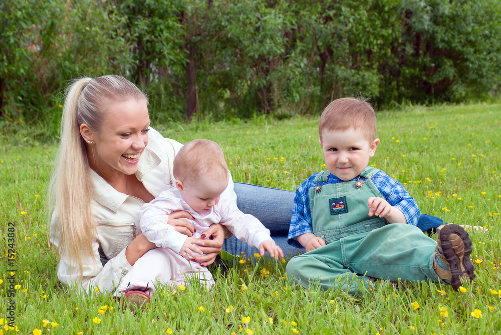 mother with children on meadow mother with children on meadow