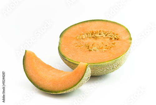 Melone halbiert und Stück