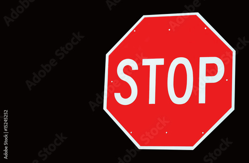 Stop Sign Isolated on Black with Copy Space