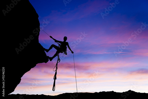 Valokuva Rock climber rappelling.
