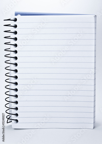 Notepad with spiral binding and white, lined pages.
