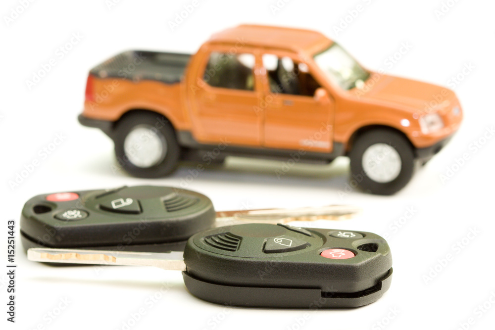 Macro picture of car key with truck as the background Macro picture of car key with truck as the background