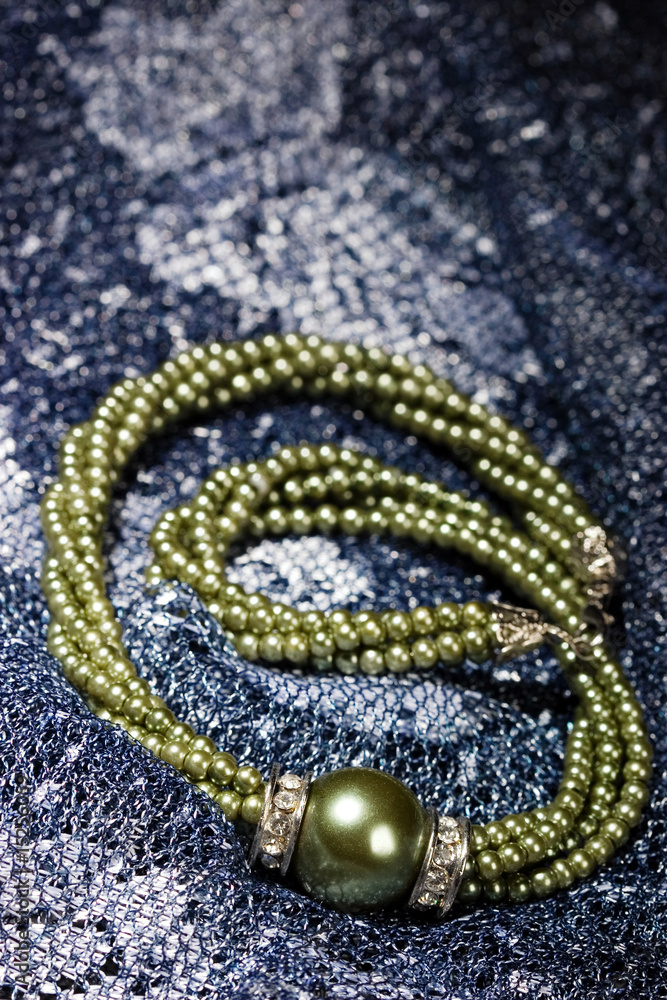 Fototapeta premium Jewelry on a blue scarf