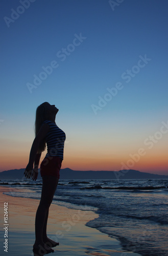 Silhouette of a woman on a beach