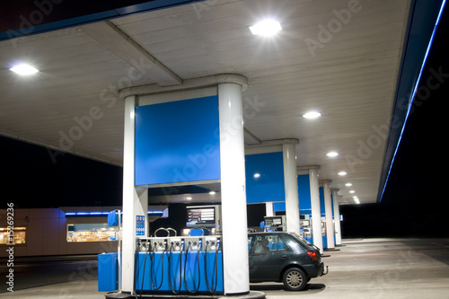 Blue filling station at night