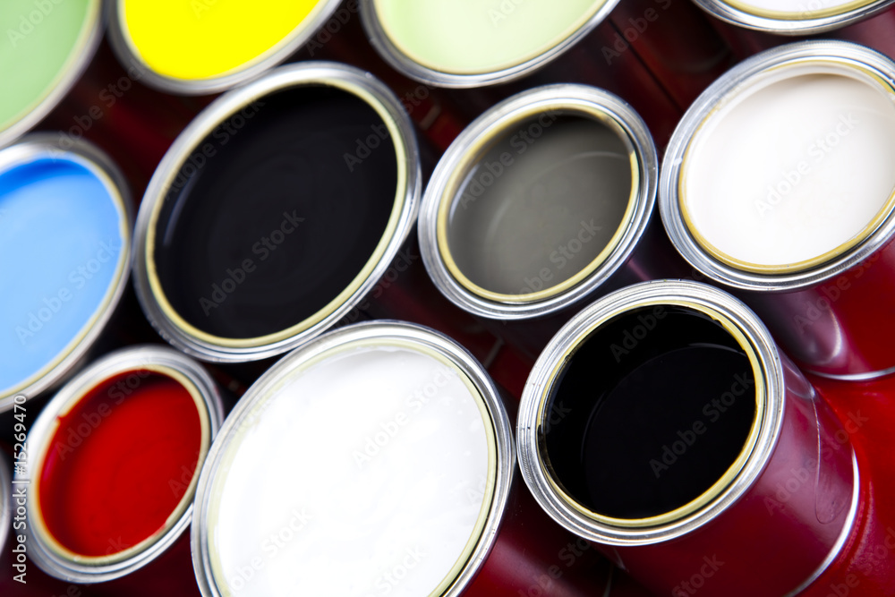 Cans and paint on the colourful background Cans and paint on the colourful background