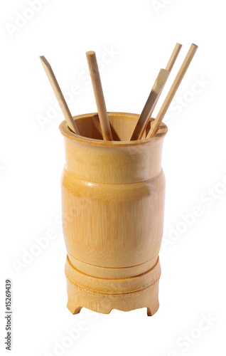 Wooden bamboo glass with the chopsticks . (isolated)