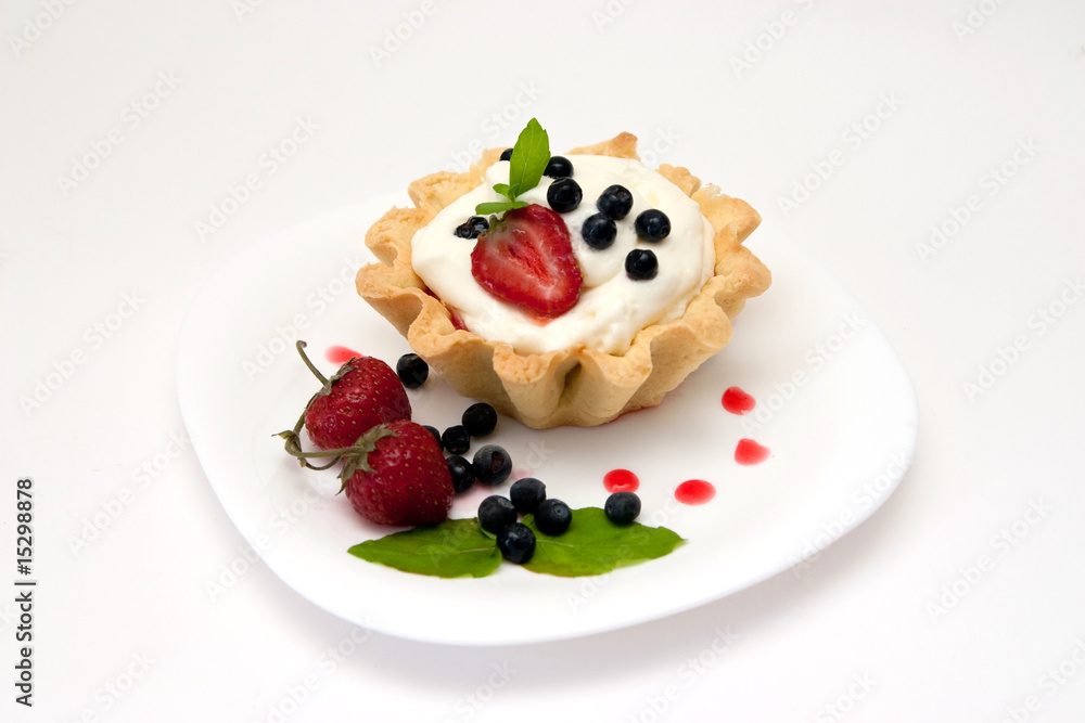 Delicious tart with berries and cream Delicious tart with berries and cream