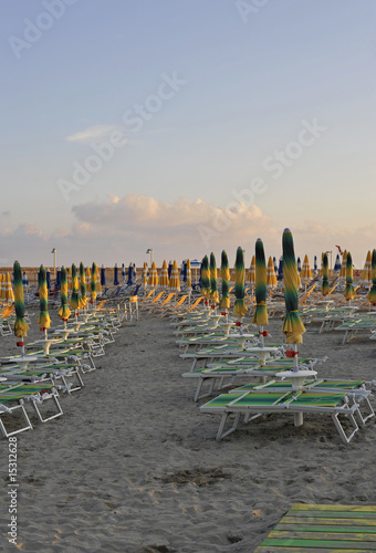 Beach-umbrellas and desk-chairs of a lido at the seaside resort