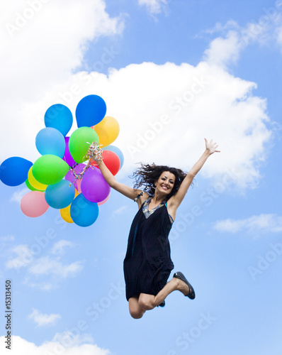 Happy woman with colorful balloons
