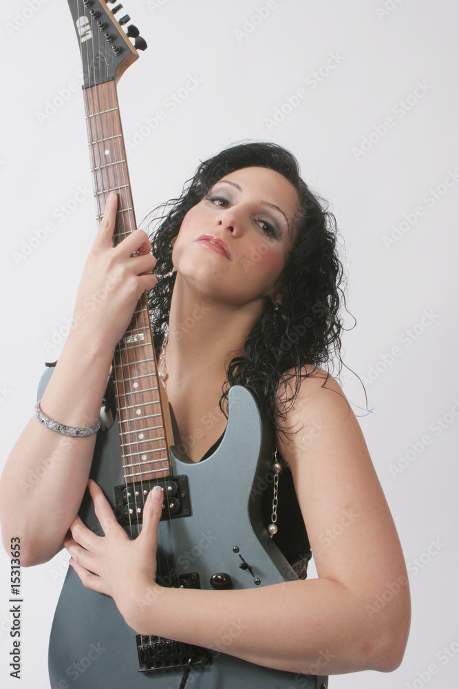 Sexy hispanic woman with guitar