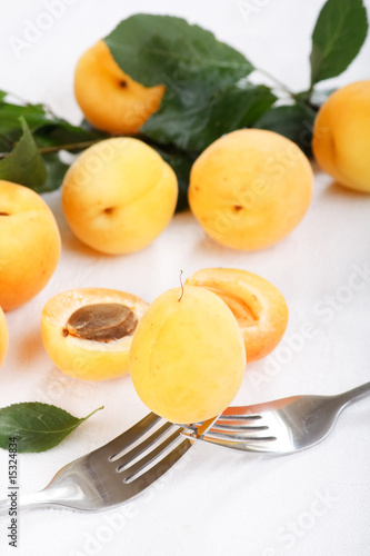 Group of Apricots with leaves photo