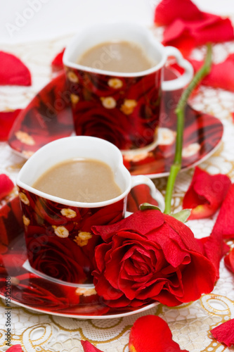 red cup of coffee with roses