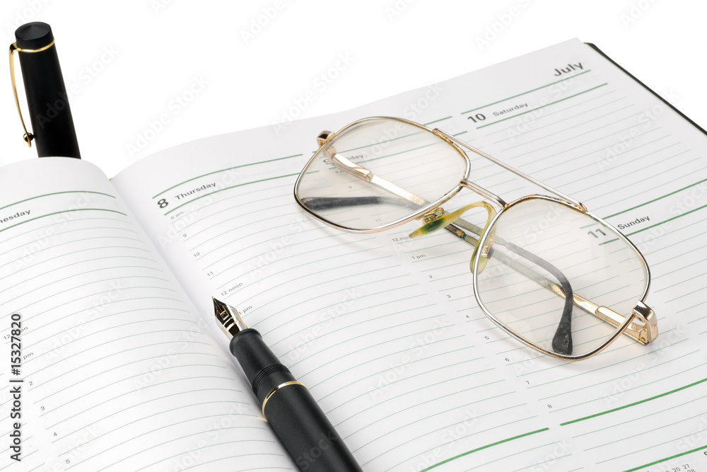 Diary with ink pen and glasses Diary with ink pen and glasses