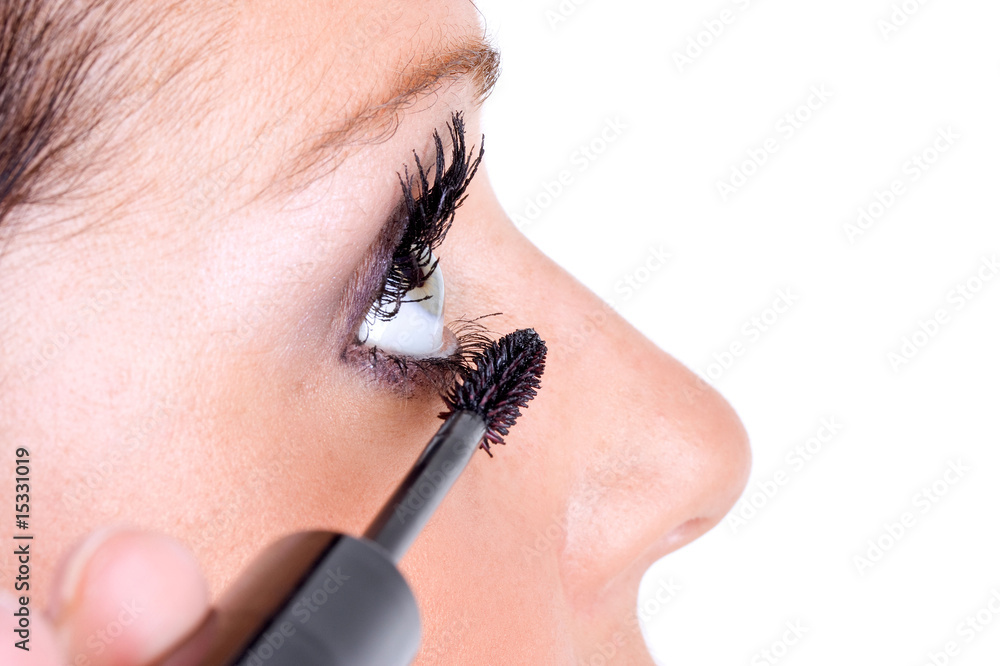 Cosmetics being applied to female model