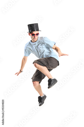 A young boy with magic hat in jump