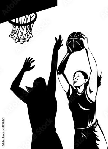 Woman basketball player shooting ball