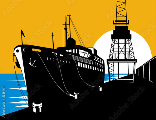 Ship at wharf being loaded by  a boom crane