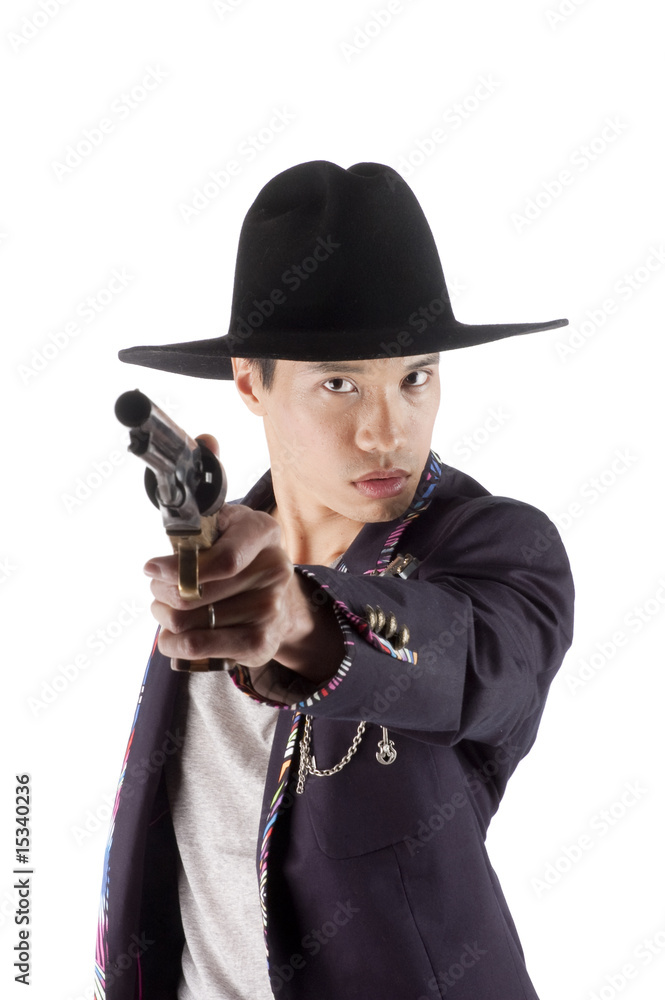 Asian cowboy with pointed at the viewer Asian cowboy with pointed at the viewer