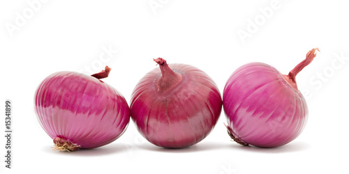 Three onions isolated on white background
