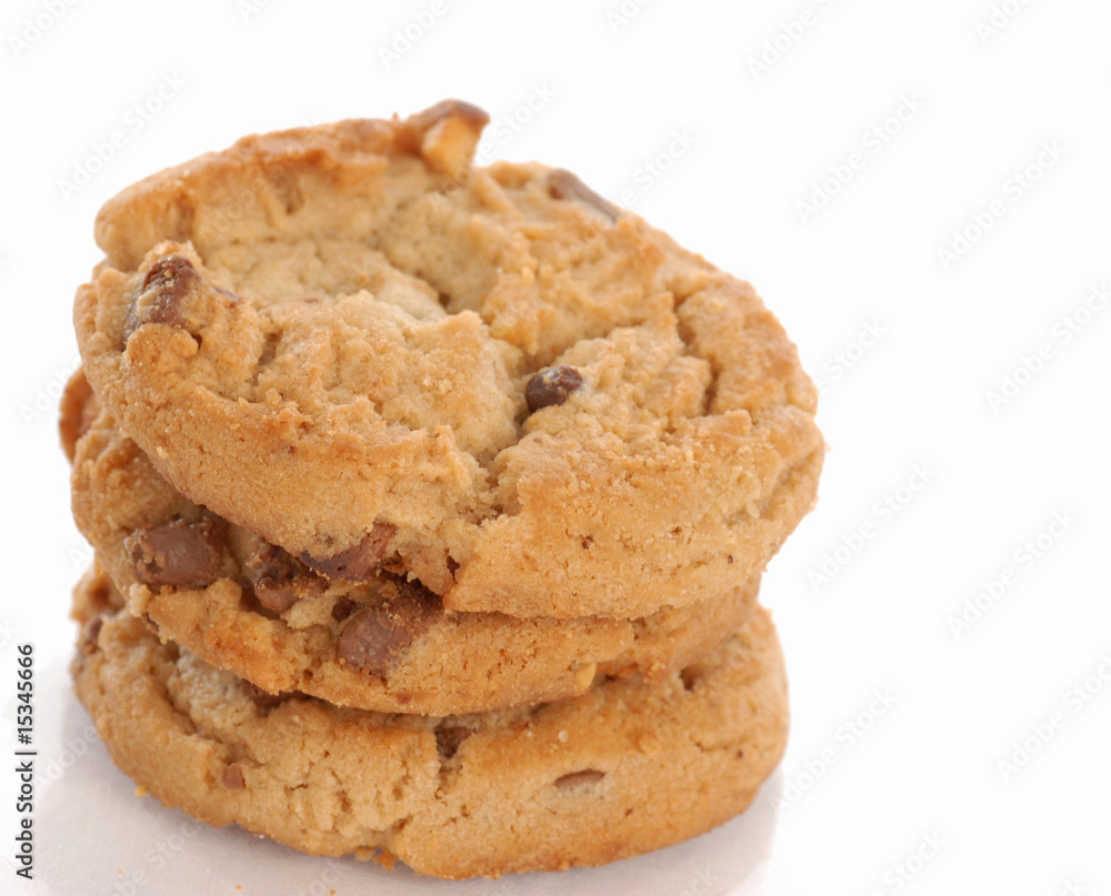 three peanut butter chocolate chips cookies stacked up three peanut butter chocolate chips cookies stacked up