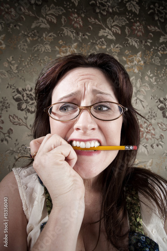 Nervous Woman Chewing on a Pencil