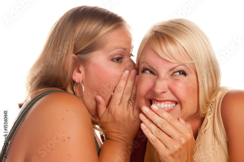 Two Blonde Women Whispering...